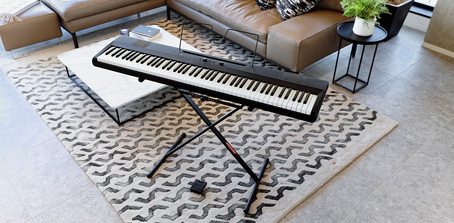 Liano includes a sustain pedal and sheet music stand